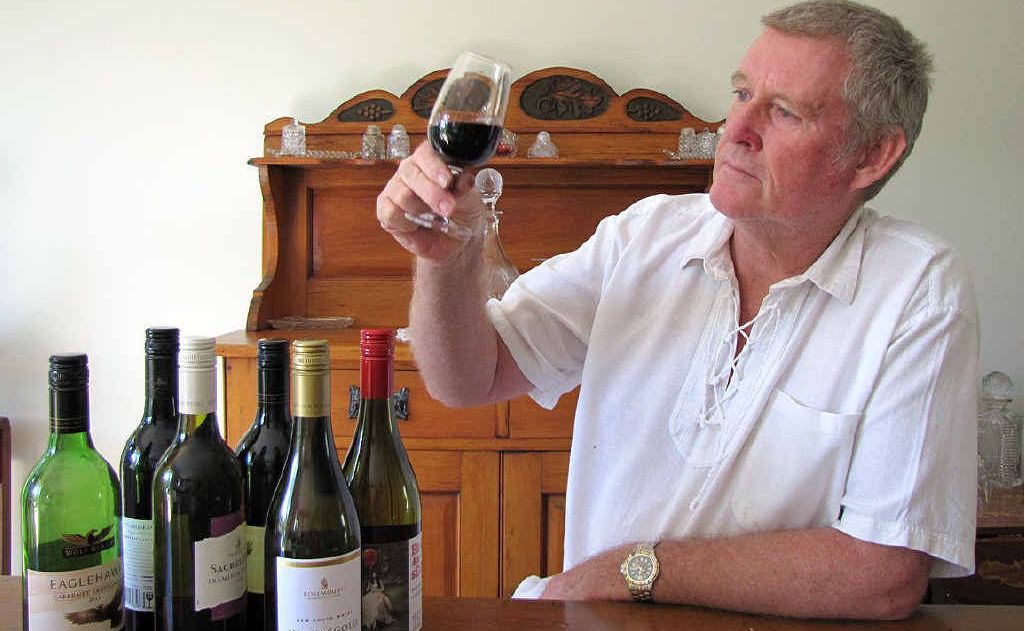 Curra Social and Sports Club member and wine expert Peter Brittain checks out the colour and clarity of a glass of red. Curra Social and Sports Club member and wine expert Peter Brittain checks out the colour and clarity of a glass of red.